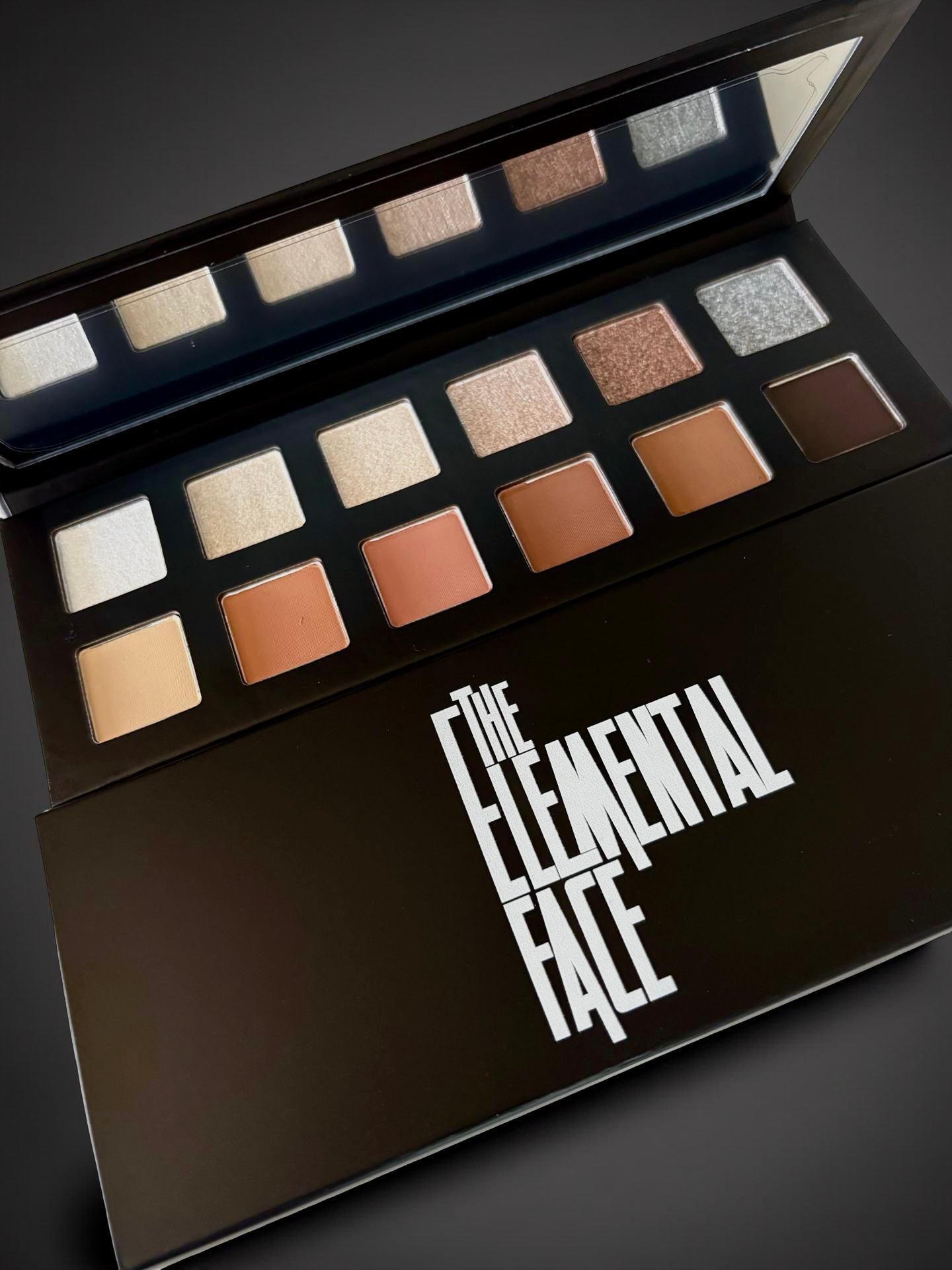 Neutral 12 Palette mixture of matte and shimmer shades in soft nude, frosted beige, silver sparkle and browns